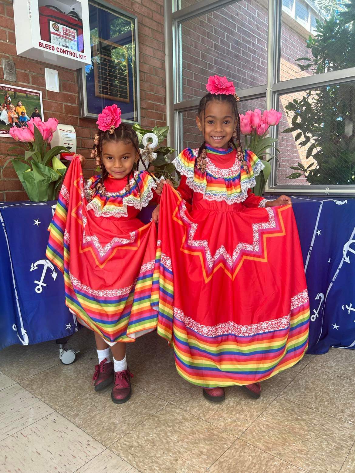 Little girls wearing hispanic dresses
