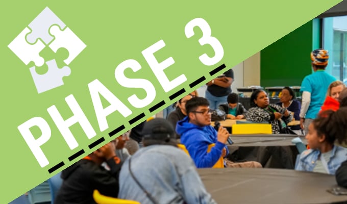 Phase-3-puzzle-pieces-students-adults-in-meeting-sharing-opinions