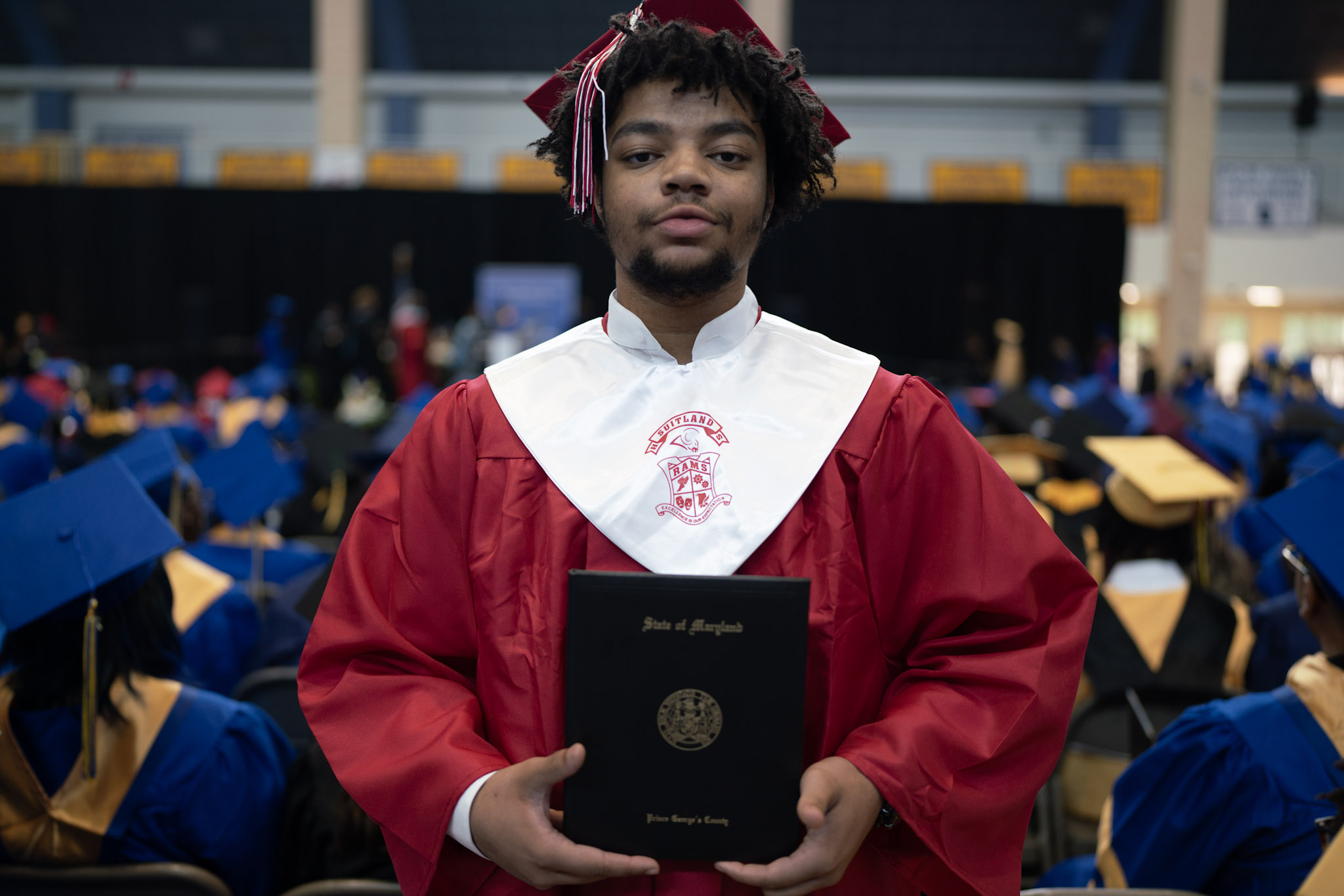 2025 boy graduate holding certificate