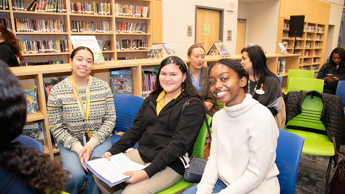 teacher-and-students-in-library