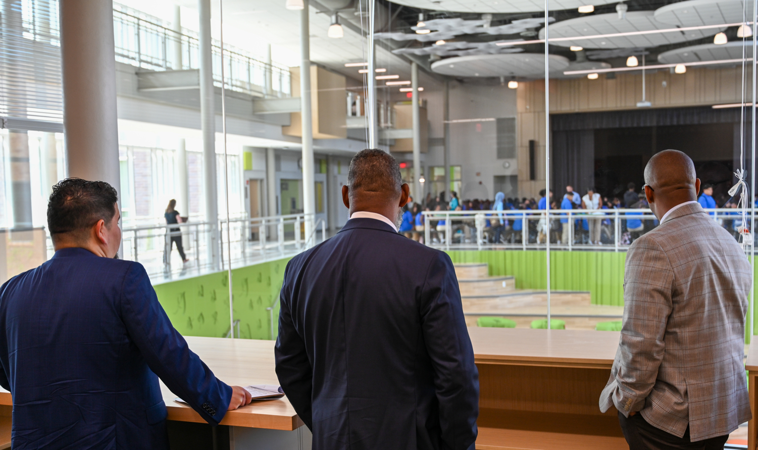 Left to right Associate Superintendent for Communications & Community Luis Morales, Director of the Blueprint Schools Program Shawn Matlock, Superintendent Millard House II view the cafeteria at Ellen Ochoa Middle School