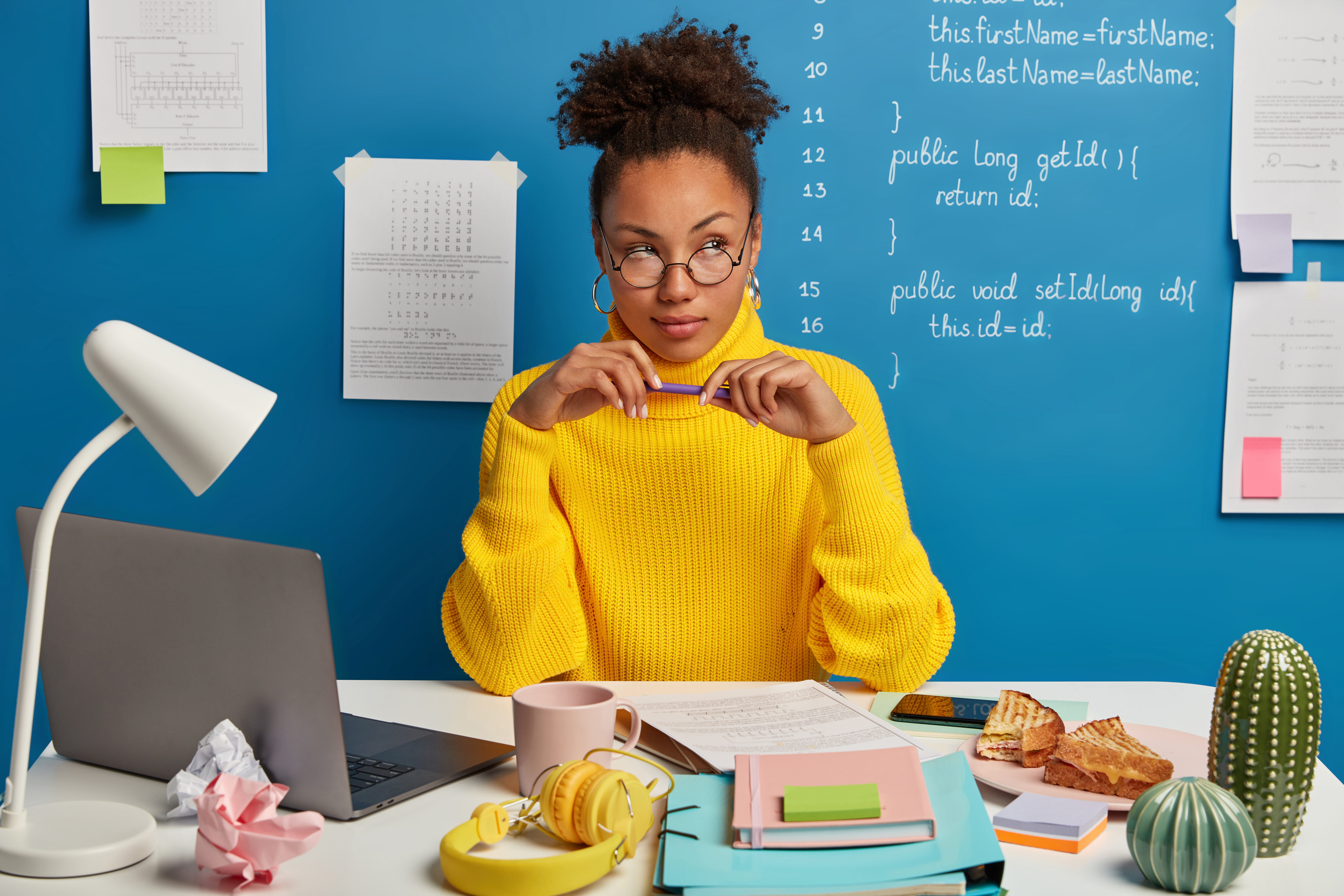black-woman-at-desk-laptop-notes-coding-computer-laptop.jpeg