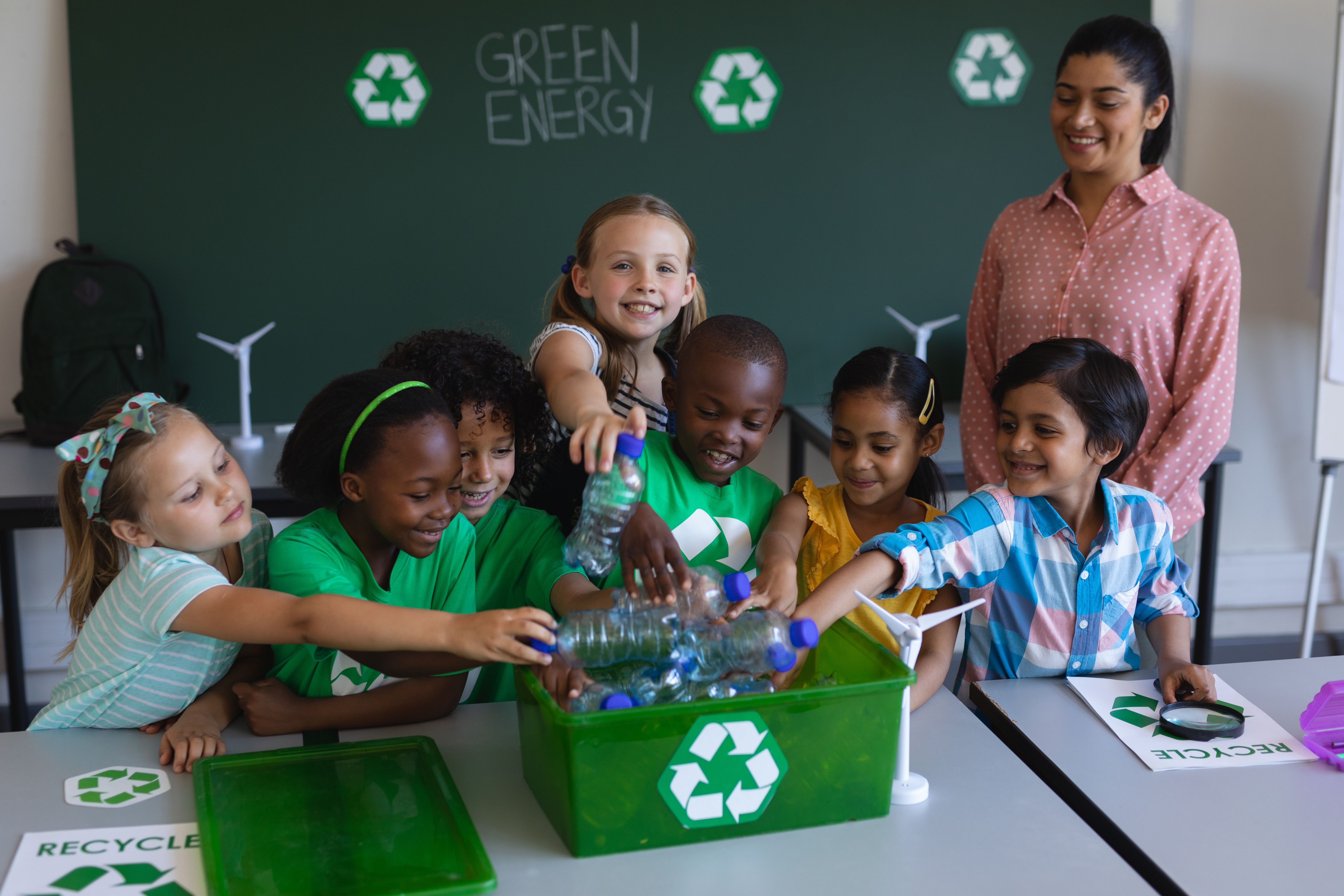 elementary students sorting recycling items