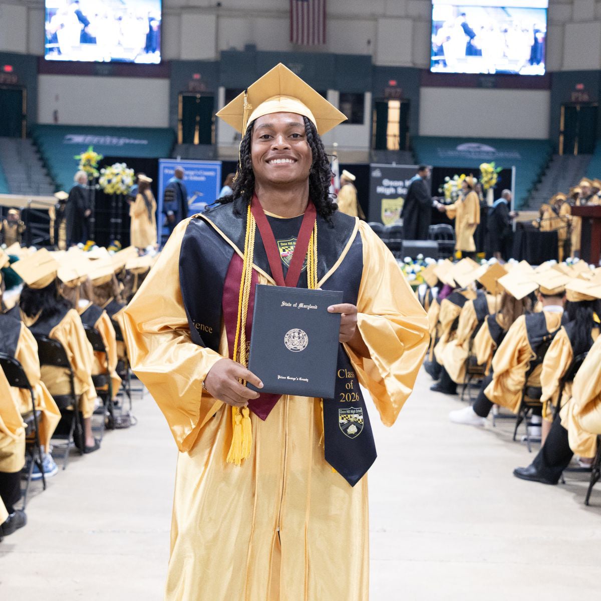 Oxon Hill HS-graduate-holding-diploma