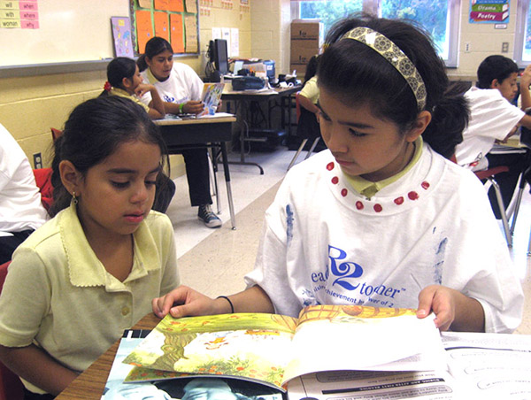 RELA-students-reading-a-book-in-class.jpg