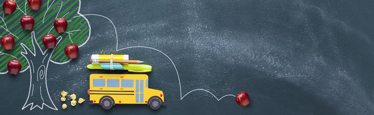 back-to-school-yellow-school-bus-tree-with-apples-on-chalkboard-background