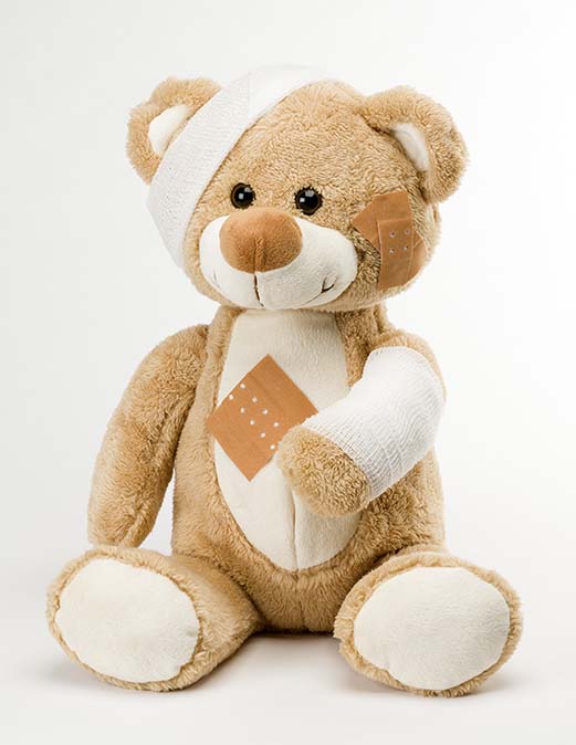 FI-school-nurse-hurt-teddy-bear-with-bandages-on-white-background.jpg