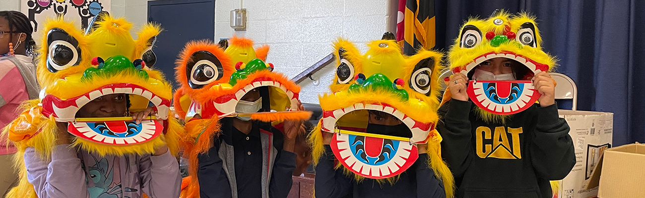 students-in-Chinese-lion-masks-celebrating-Chinese-New-Year