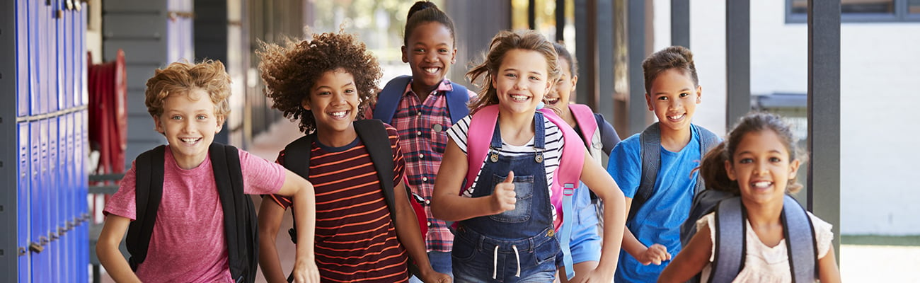 Group of children running outside