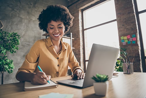 staff-parent-adult-female-on-computer-taking-notes-training