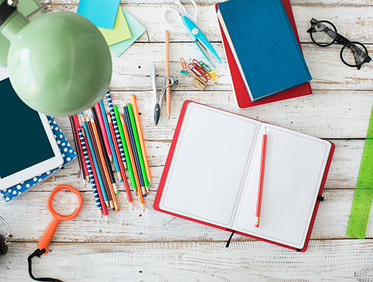 desk-with-notebook-pencils-paperclips-ruler-tablet-office